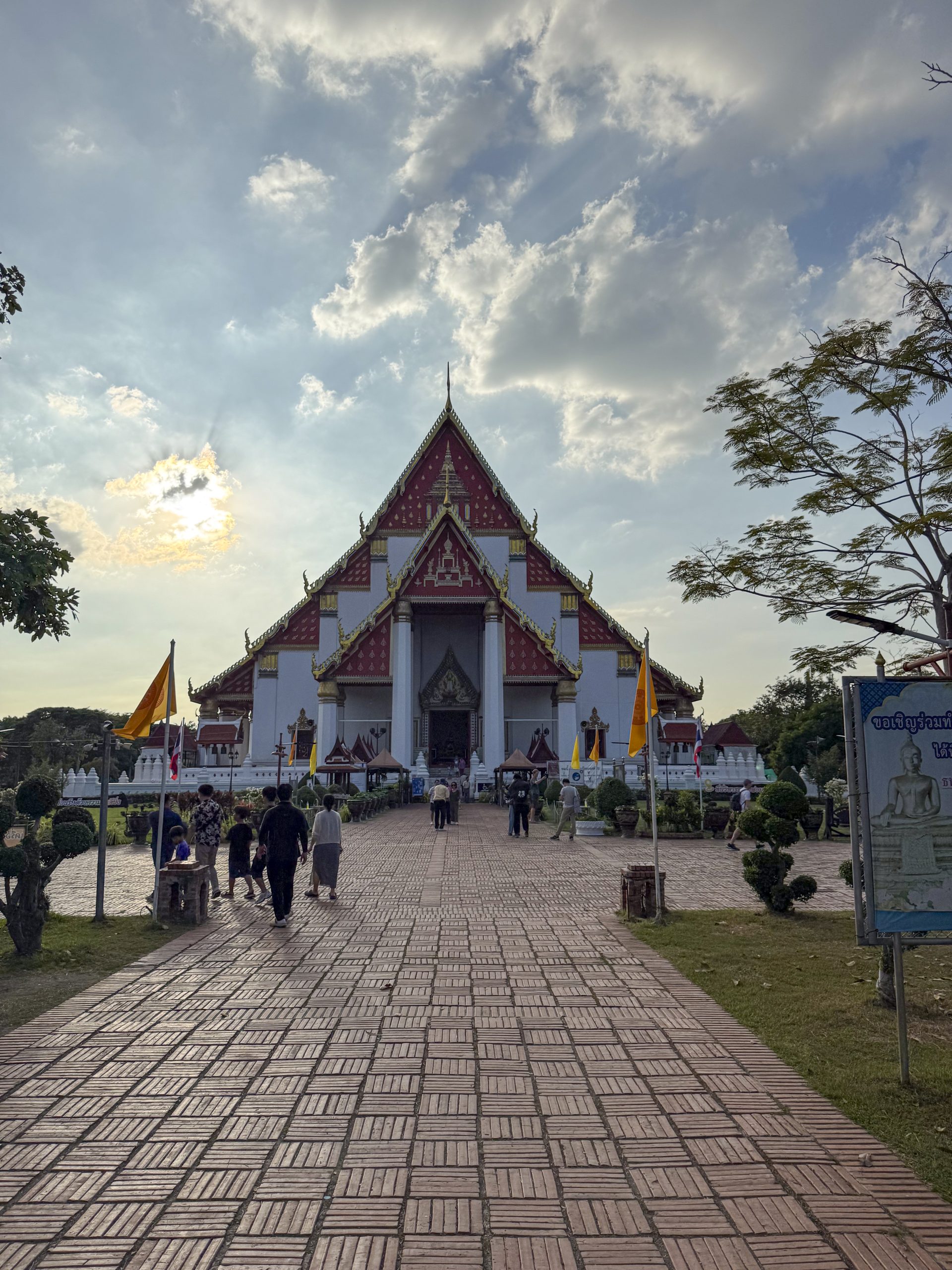 Bangkok, Thailand - November 11, 2024: Traditional Thai temples in bustling district, modern buildings and lively streets offering visitors a scenic cultural experience in the heart of the capital.