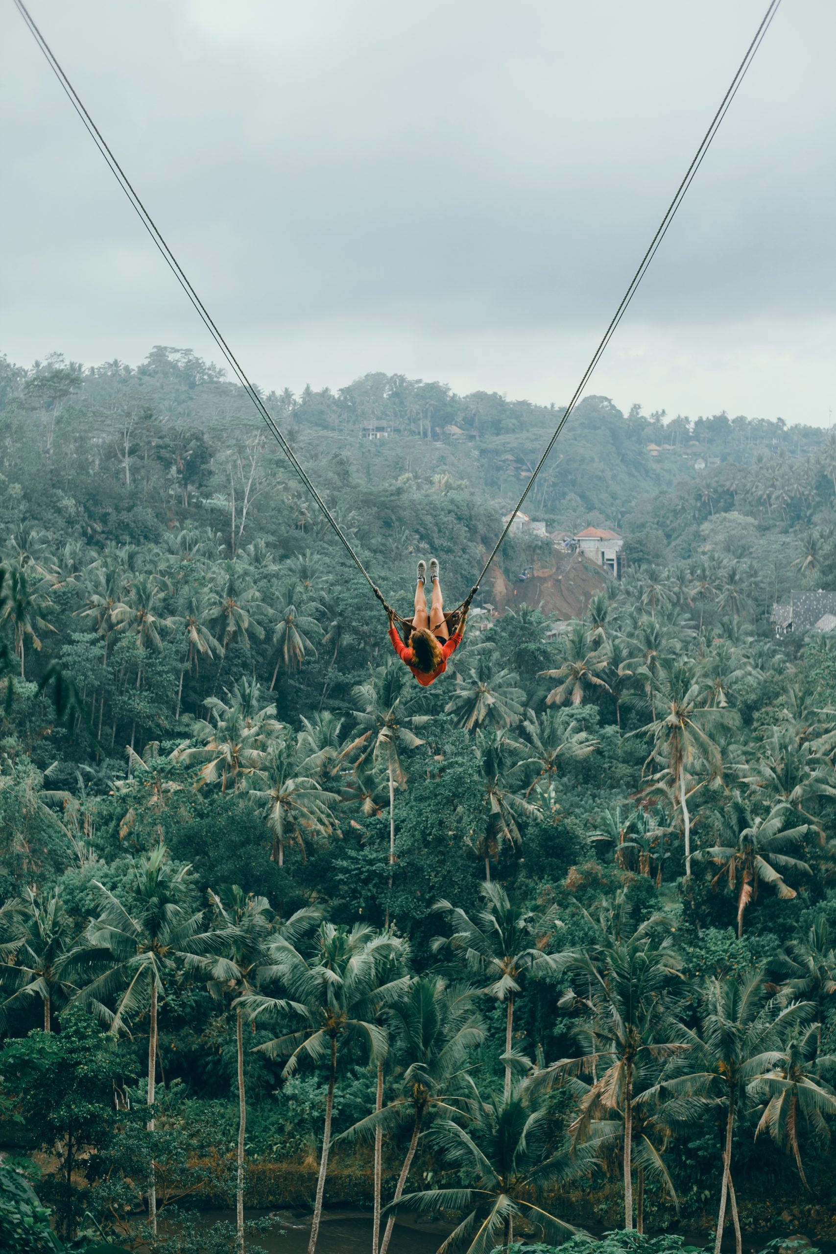 Beauty woman on swing, Bali nature, happy face, jungle